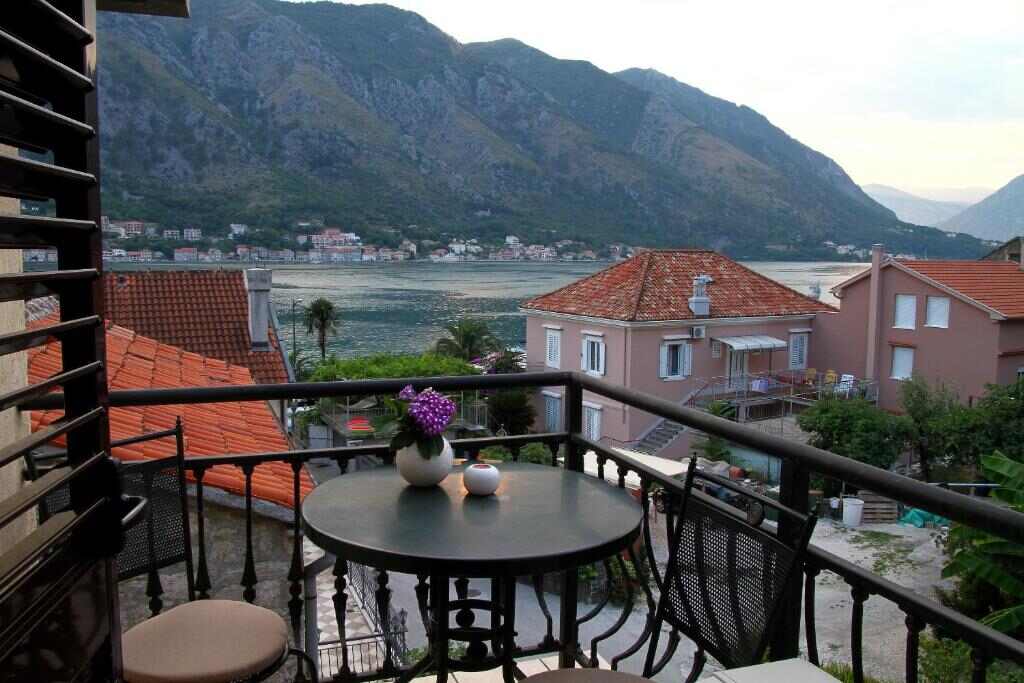 Balcony table with view over Kotor Bay and the mountains